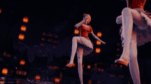 女团成员身着红舞表演折扇舞的动态画面