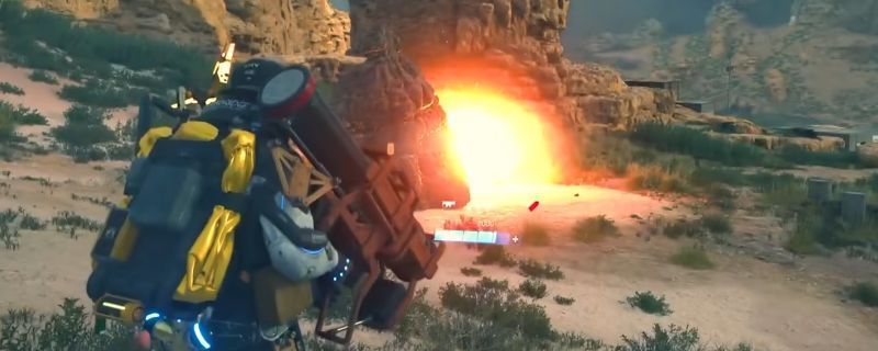 《死亡搁浅2》中角色手持火箭筒发射的瞬间，爆炸火光四溅，场面震撼