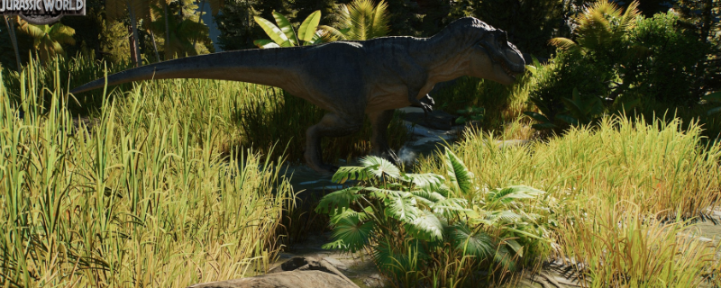 《侏罗纪世界:进化3》游戏内实机画面:三只巨型暴龙昂首矗立于火山地貌围栏中,岩浆微光映照鳞甲,背景可见游客观景台与警示红灯闪烁